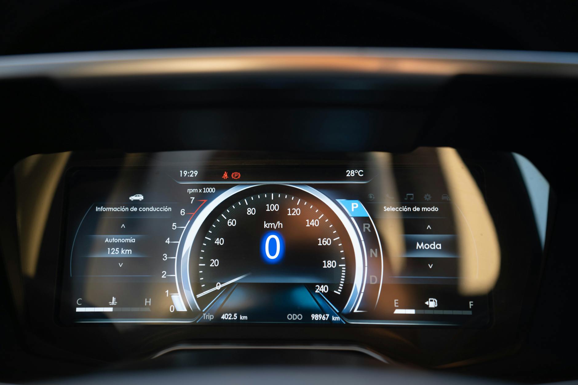 digital car dashboard showing speedometer zero